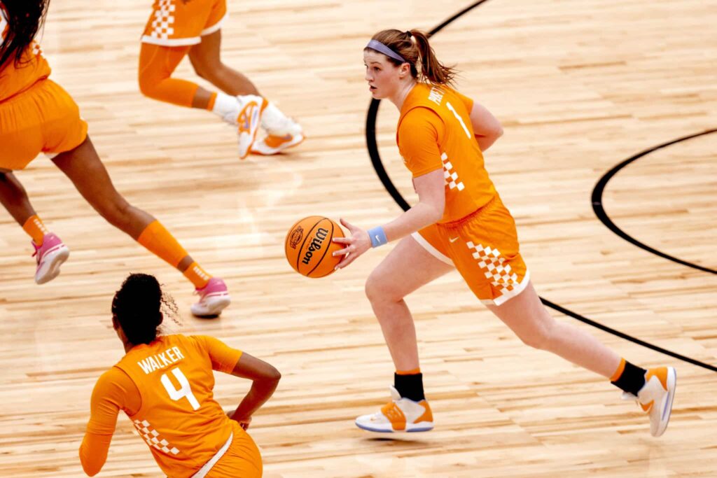 A Lady Vol basketball player dribbles down court during a game