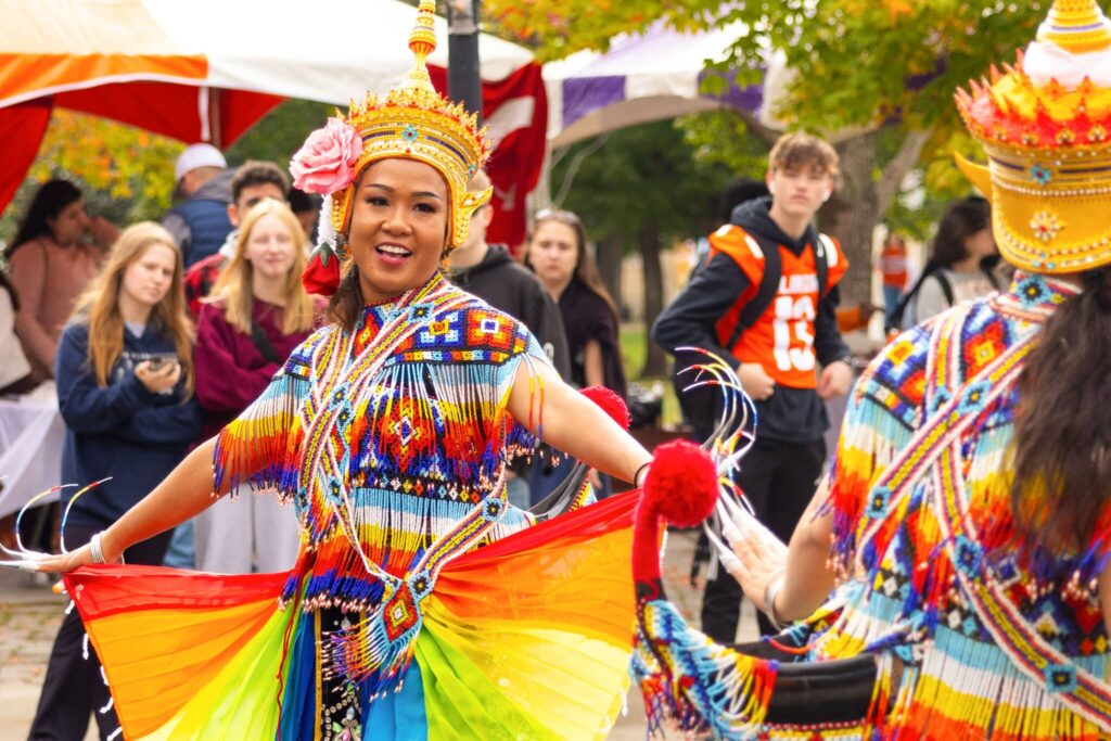 A woman dressed in Thai traditional costume performs at the International Festival