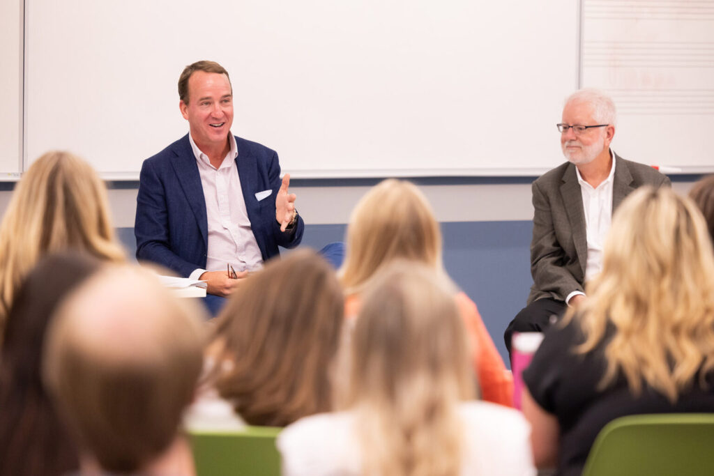 Peyton Manning speaks to a class