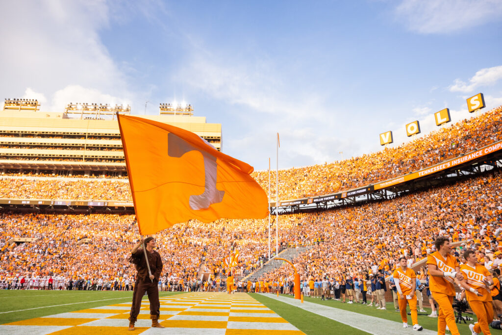 Davy Crockett waves the Power T flag in the endzone in front of fans during the Tennessee Volunteers football home opener against Austin Peay Governors inside Neyland Stadium