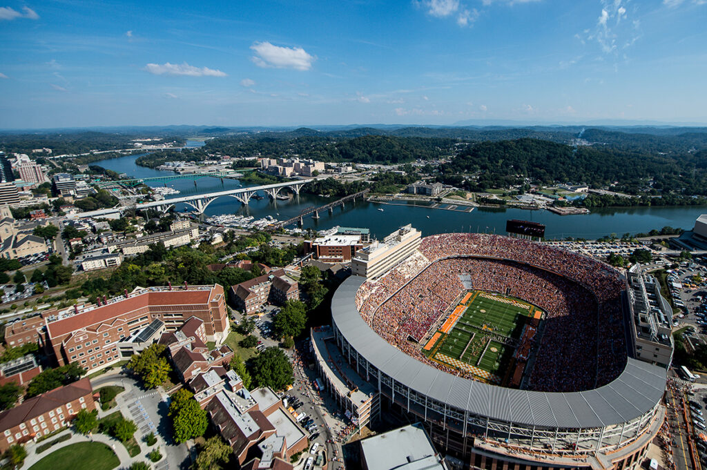 Aerial of Neyland Stadium, the Hill, Engineering area of campus, Tennessee River, beautiful blue sky, football game day, home game, gay street bridge, south knoxville