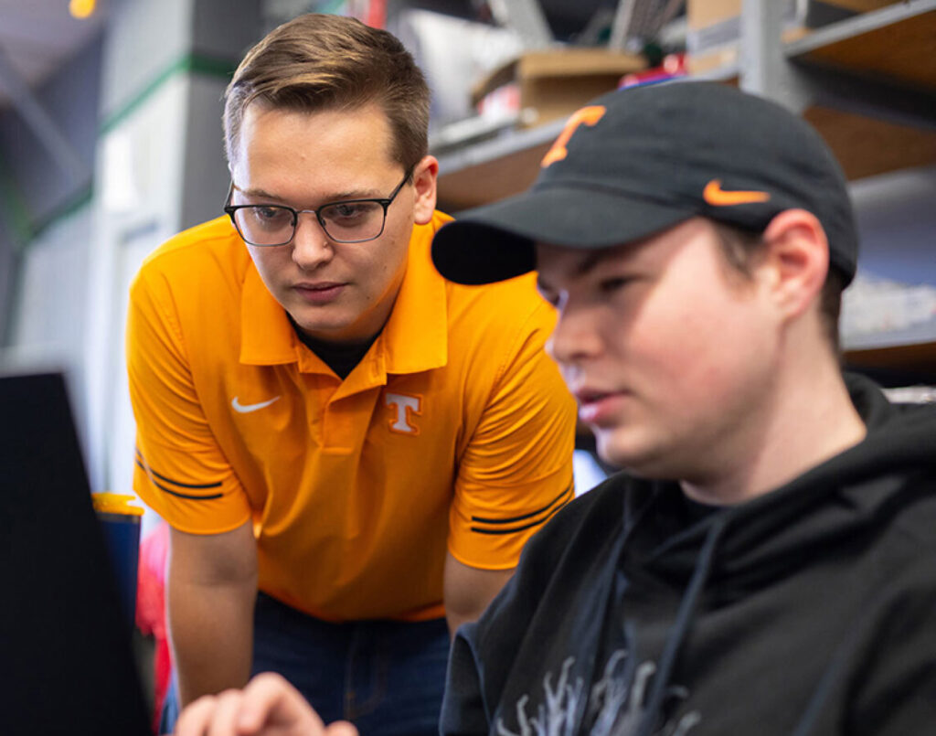 Two students work together at a computer
