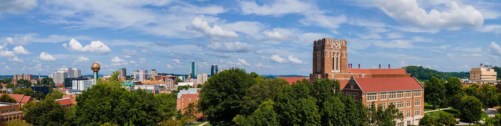 Aerial shot of Ayres Hall on a sunny day with downtown Knoxville in the background
