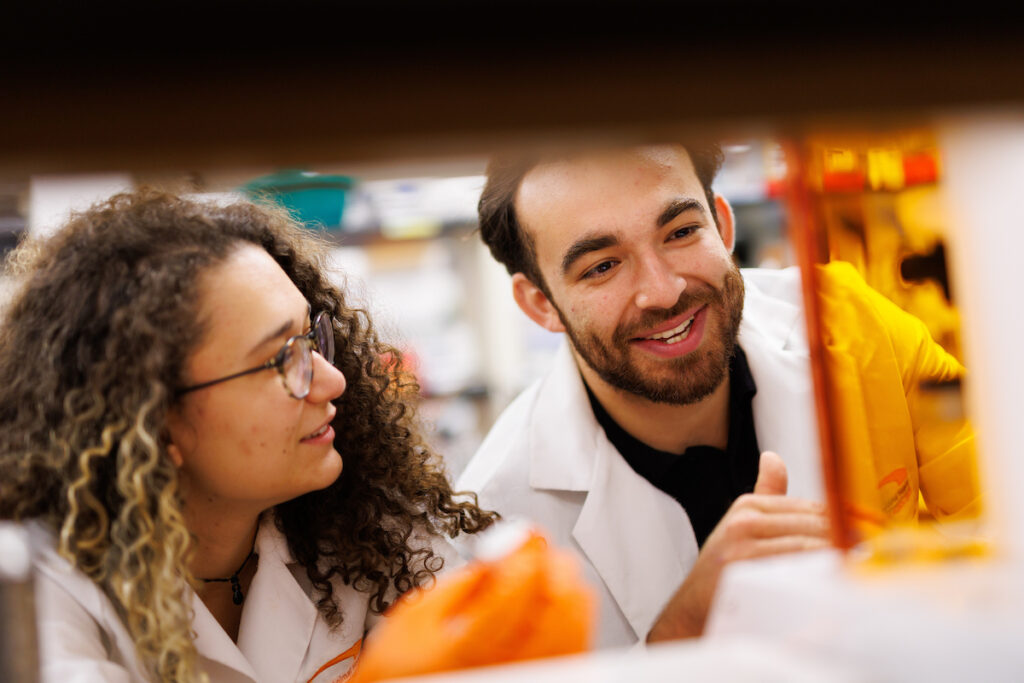 Two graduate students discuss bio-ink to be used in the 3D printer in the Regenerative Medicine and Tissue Engineering Lab inside the College of Veterinary Medicine. Photo by Steven Bridges, University of Tennessee.
