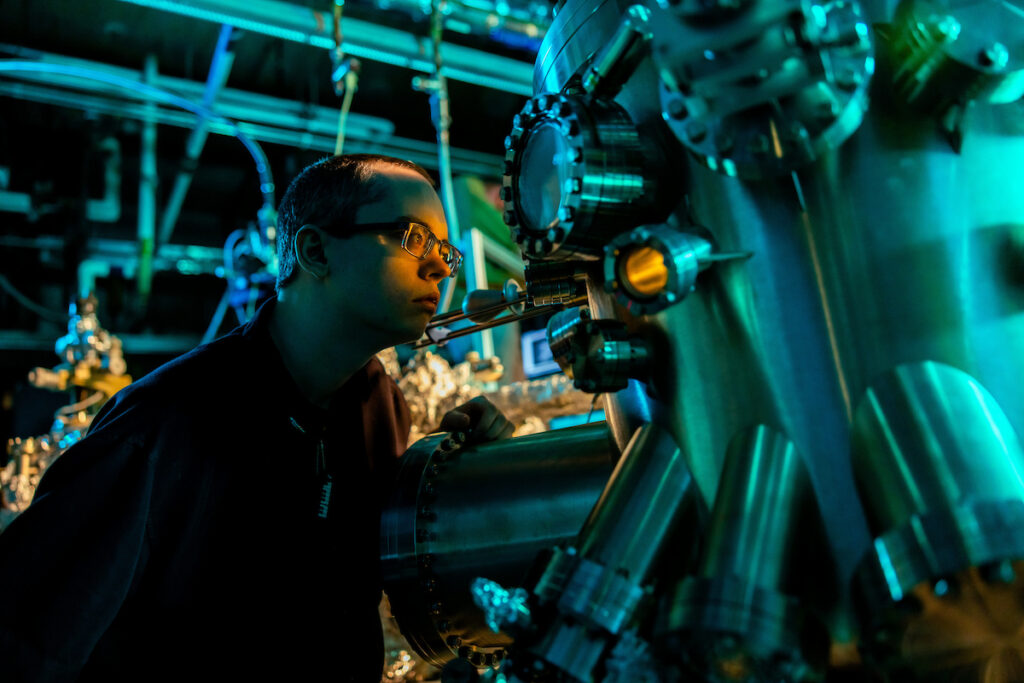 A graduate student works in the Molecular Beam Epitaxy Core Facility for a research photo created on January 23, 2023. Photo by Steven Bridges/University of Tennessee.