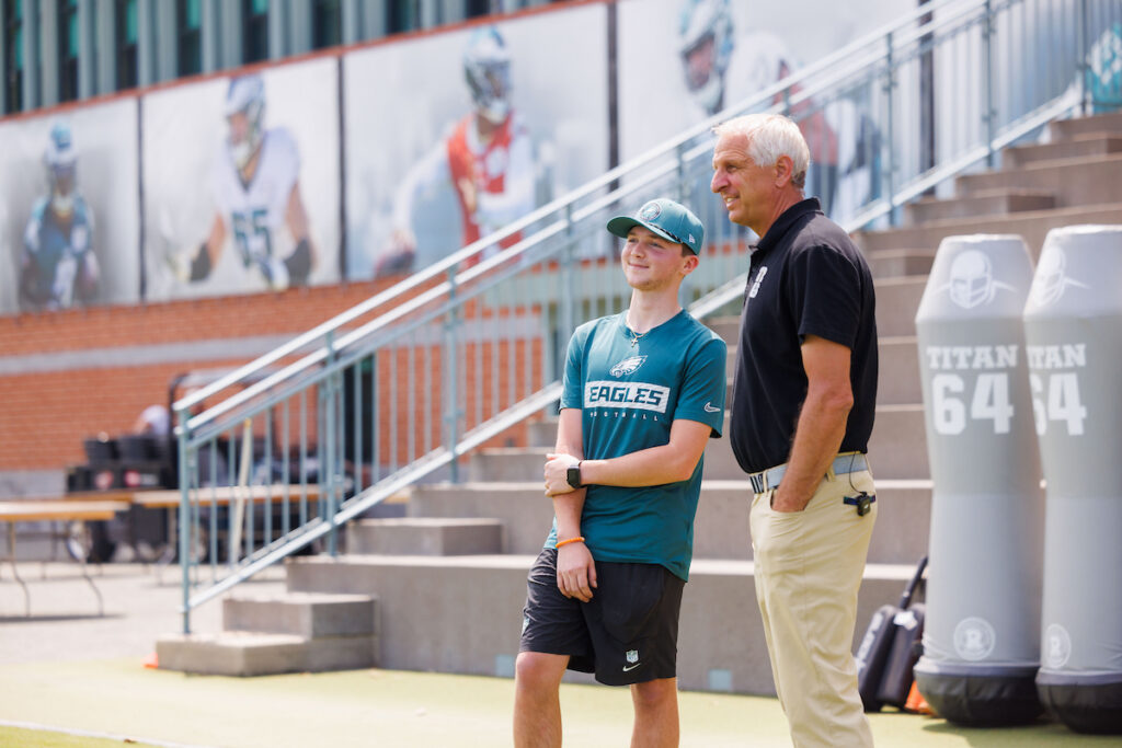 An intern and turfgrass student, visits with John Sorochan, Distinguished Professor of Turfgrass Science and Management, while working the Philadelphia Eagles practice facility
